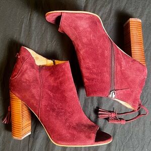 Burgundy suede open-toe booties with a wooden heel